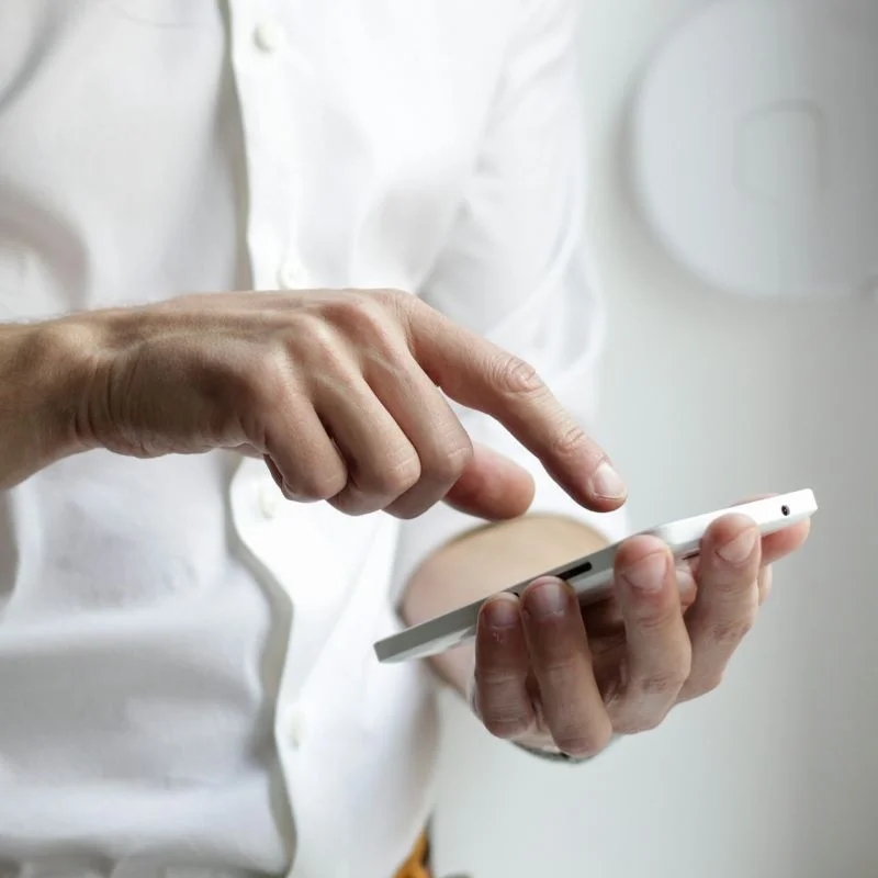 Person using their cellphone to contact